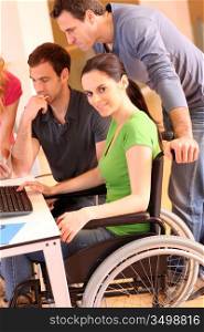 Woman in wheelchair attending group meeting