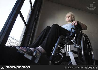 Woman in wheelchair in room