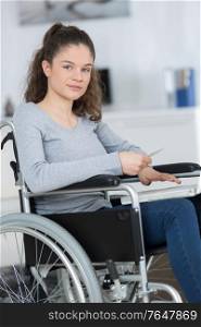 woman in wheelchair using computer