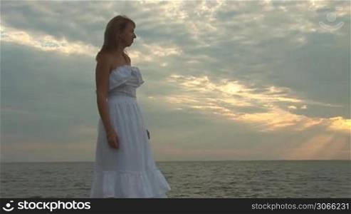 woman in white dress on the beach