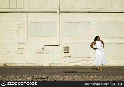 Woman in white dress waiting