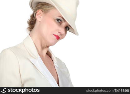 Woman in white hat and dinner jacket