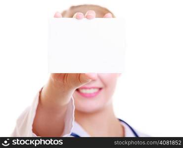 Woman in white lab coat recommending your product. Doctor or nurse with stethoscope holding blank copy space card isolated. Medical person for health insurance.