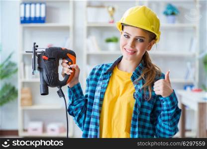 Woman in workshop with circular saw. The woman in workshop with circular saw