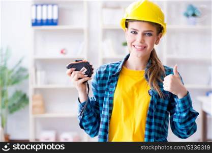 Woman in workshop with measuring tape