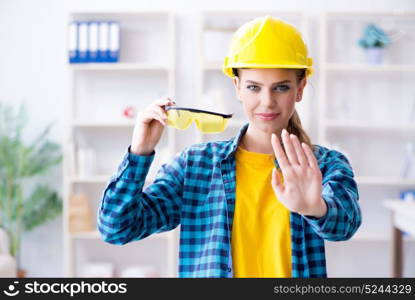 Woman in workshop with protective goggles