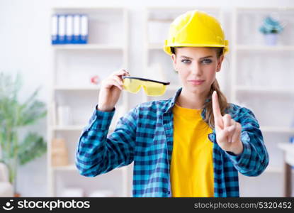 Woman in workshop with protective goggles