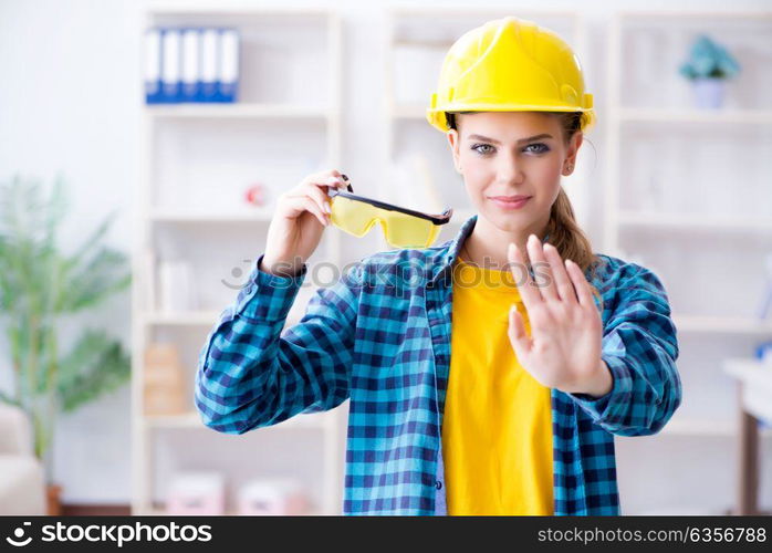 Woman in workshop with protective goggles