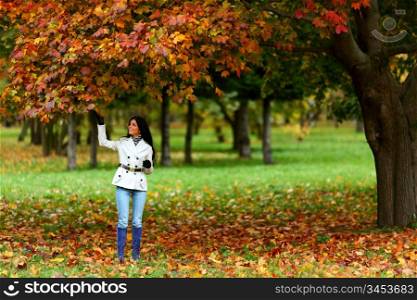 woman in yellow autumn park