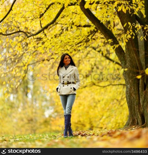 woman in yellow autumn park