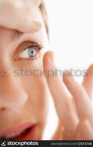 Woman Inserting Contact Lens