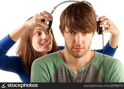 Woman interupts man with headphones