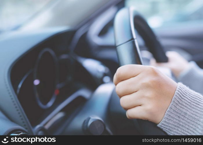 Woman is driving car