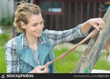 woman is drying something outdoors