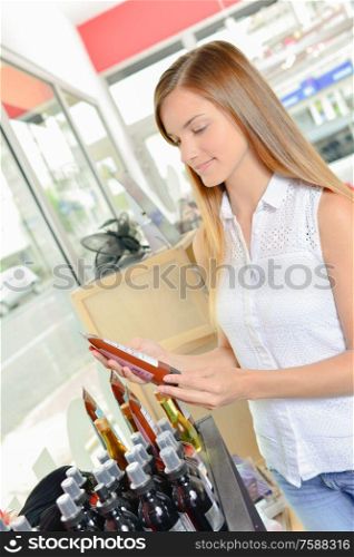 woman is holding hair product