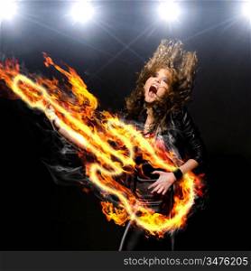 woman is playing rock music on fiery guitar and singing