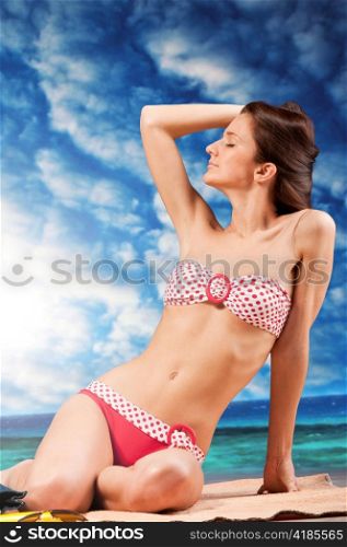 woman is sitting at beach, dramatic skies