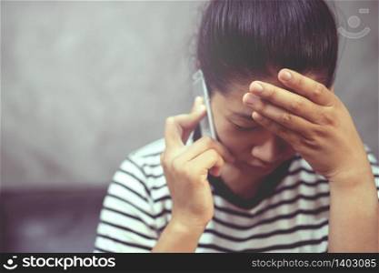 Woman is talking on the phone with boyfriend, she regrets breaking up with boyfriend