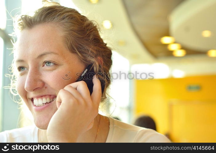 woman is talking phone and looking sideways