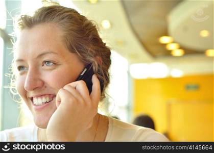 woman is talking phone and looking sideways