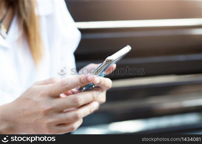 Woman is using a telephone to contact customers