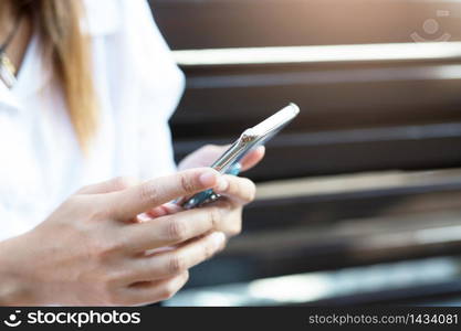 Woman is using a telephone to contact customers