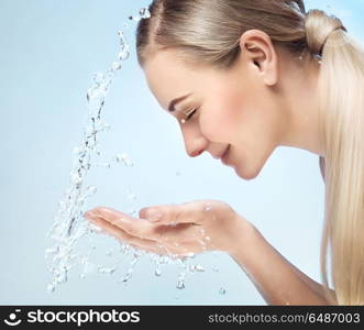 Woman is washing her face, fresh morning skin look, removing makeup, using anti acne or anti aging agent, pampering and beauty care concept. Fresh face