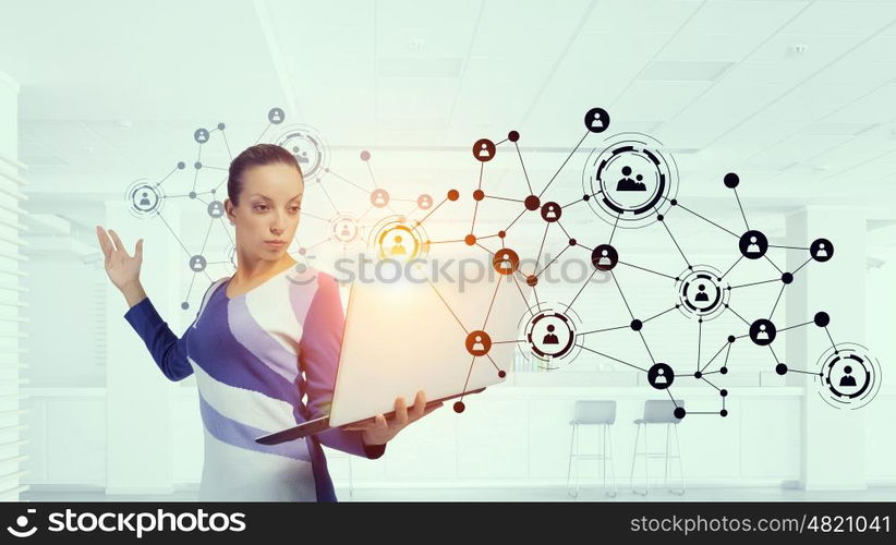 Woman IT manager. Young woman in casual with laptop presenting social net concept