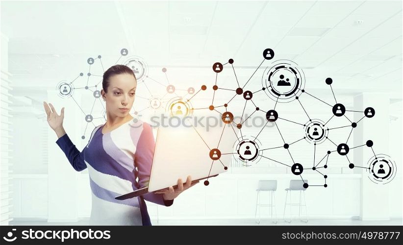 Woman IT manager. Young woman in casual with laptop presenting social net concept