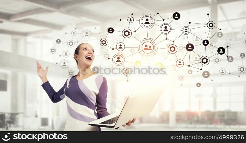 Woman IT manager. Young woman in casual with laptop presenting social net concept