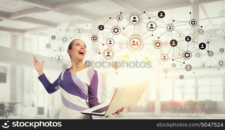 Woman IT manager. Young woman in casual with laptop presenting social net concept