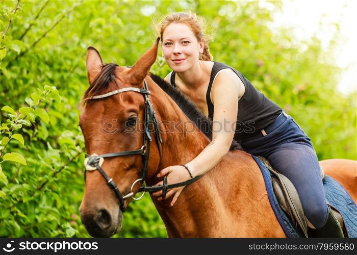 Woman jockey training riding horse. Sport activity. Active woman girl jockey training riding horse. Equestrian sport competition and activity.