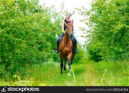 Woman jockey training riding horse. Sport activity. Active woman girl jockey training riding horse. Equitation sport competition and activity.