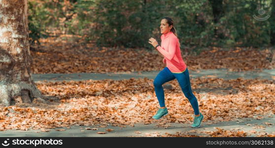 Woman Jogging. Nature, Outdoor Park. Woman Jogging Outdoors in Park