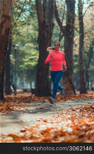 Woman Jogging. Nature, Outdoor Park. Woman Jogging Outdoors in Park