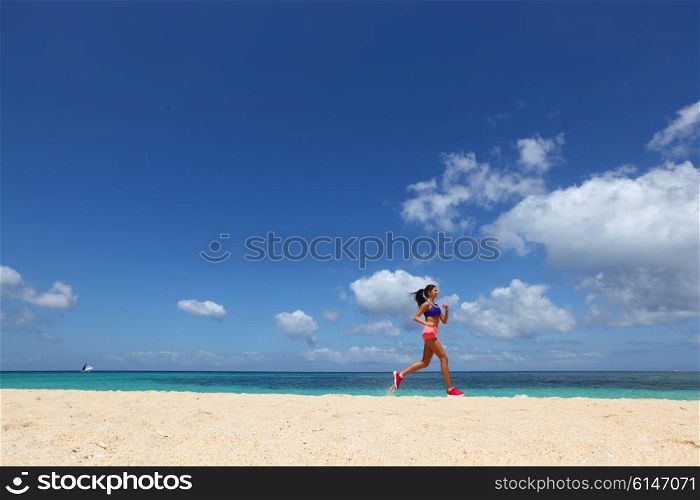 Woman jogging on beach . Running woman jogging on beach and sea on background