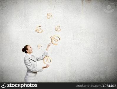 Woman juggler. Young pretty businesswoman juggling with euro symbols