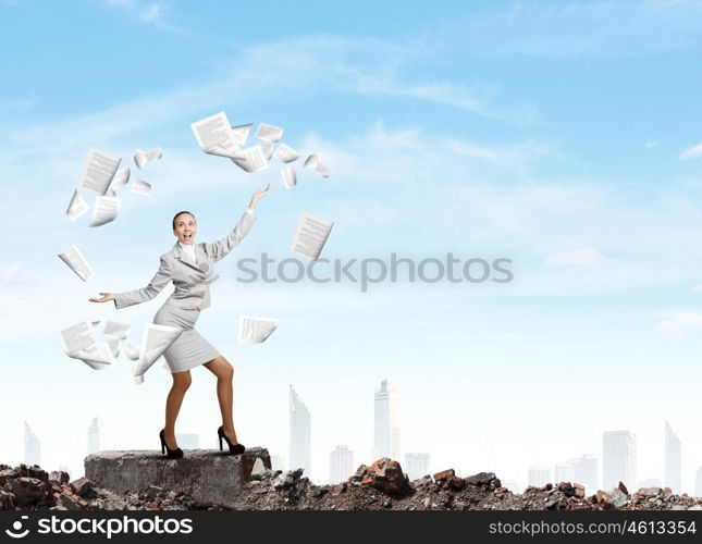 Woman juggler. Young pretty businesswoman juggling with paper sheets