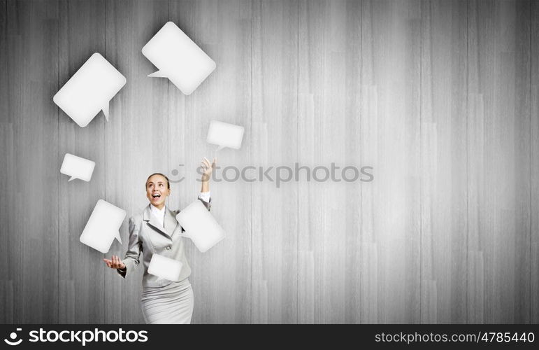 Woman juggler. Young pretty businesswoman juggling with speech bubbles