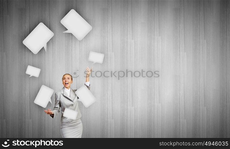Woman juggler. Young pretty businesswoman juggling with speech bubbles