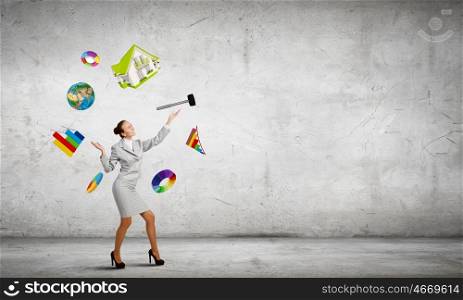 Woman juggler. Young pretty businesswoman juggling with white balls. Elements of this image are furnished by NASA