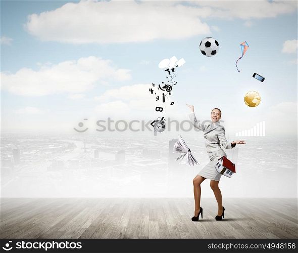 Woman juggler. Young pretty businesswoman juggling with white balls