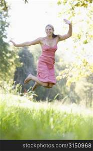 Woman jumping in a park