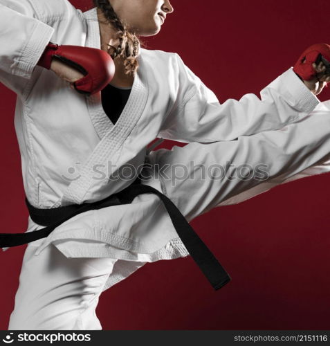woman jumping with box gloves red background