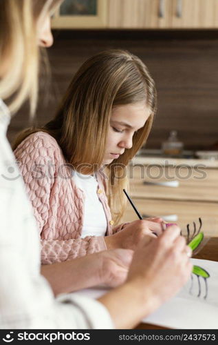 woman kid painting butterflies close up