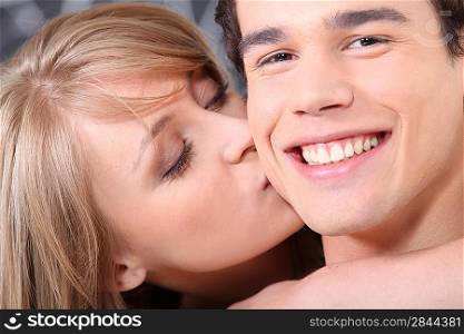 Woman kissing her boyfriend