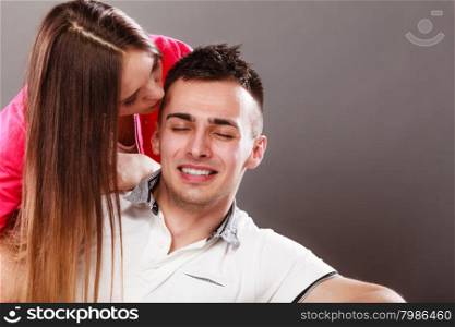 Woman kissing man. Happy couple. Love.. Woman kissing man in cheek. Wife and husband flirting. Happy joyful couple. Good relationship.