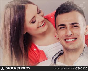 Woman kissing man in cheek. Wife and husband flirting. Happy joyful couple. Good relationship.