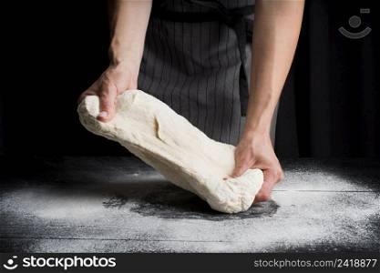 woman kneading dough table