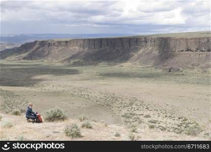 Woman kneeling in a landscape